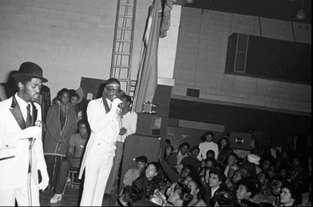 Audience at the Hoe Avenue Boy's Club circa 1981 by Joe Conzo